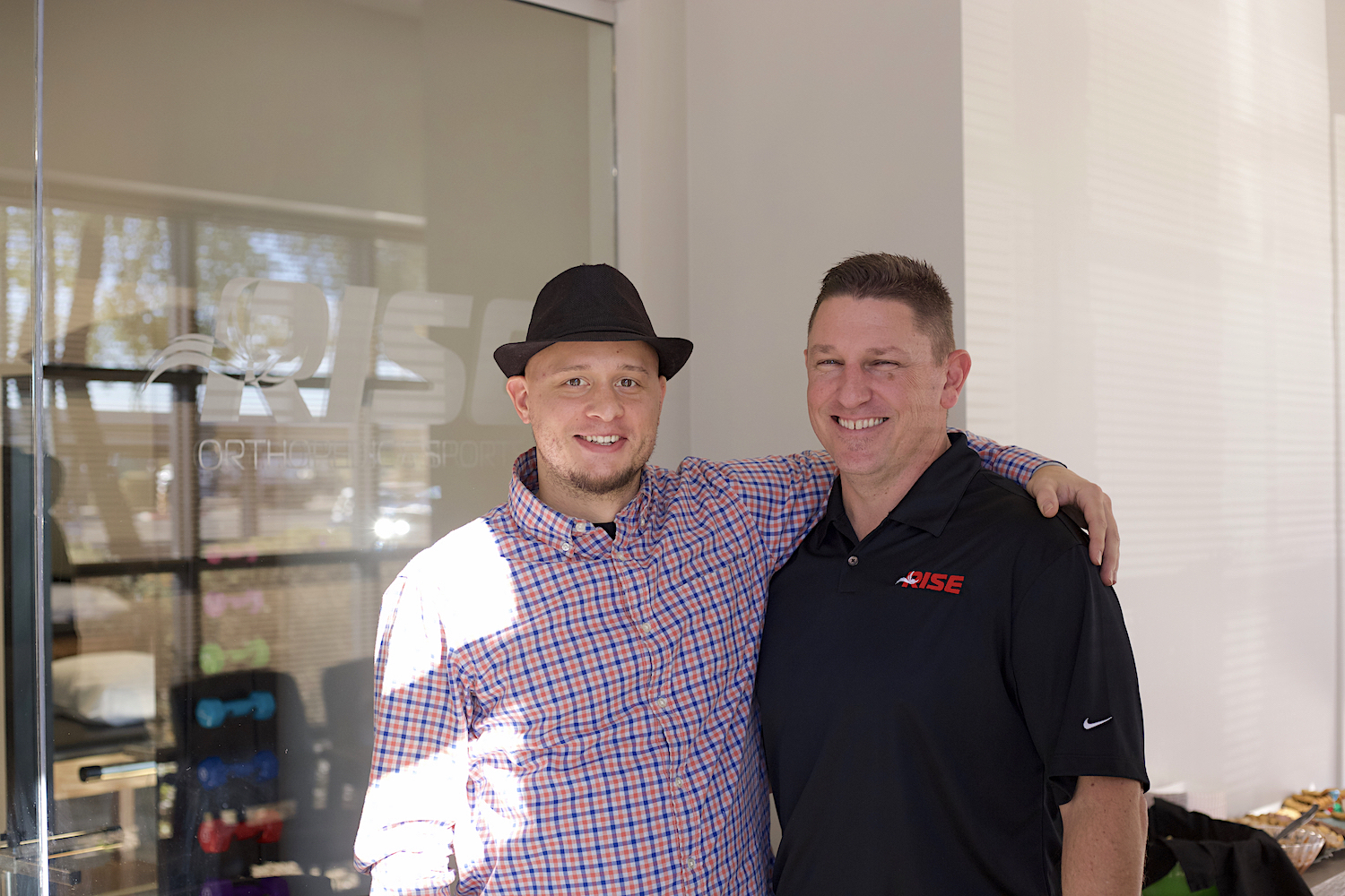 brand-development-services-in-west-phoenix-during-launch-of-rise-orthopedic-and-sports-pt-in-surprise-az-picture-of-jordan-trask-with-client-and-owner-mark-jagodzinski