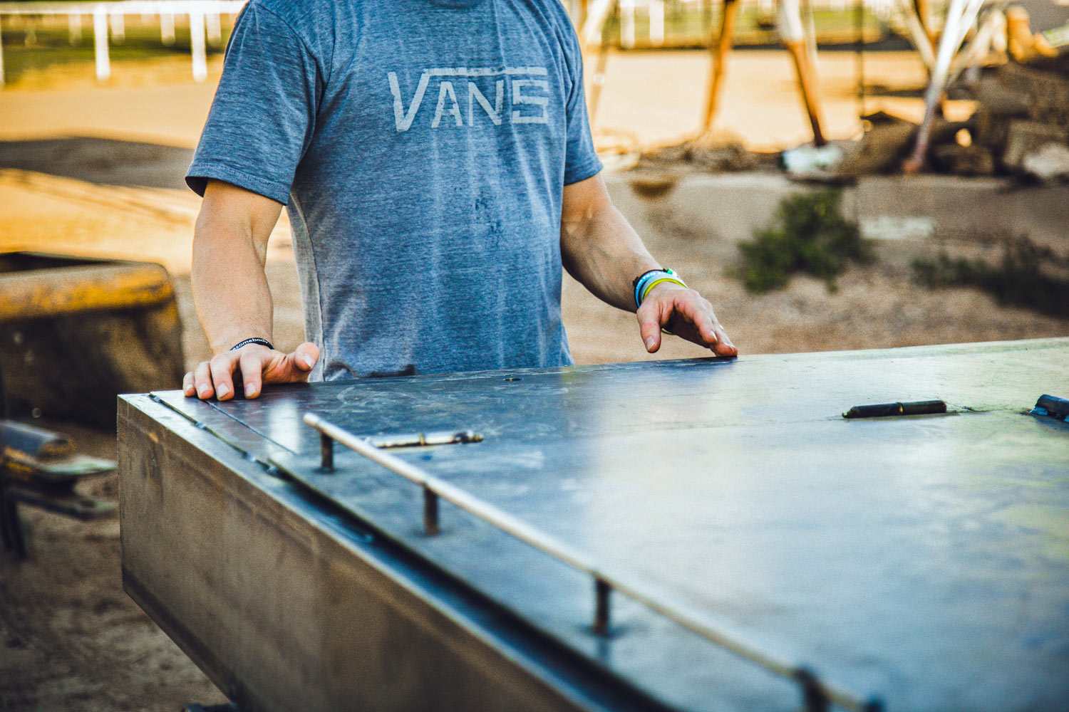 creative-director-for-brand-imagery-photoshoot-in-phoenix-az-jordan-trask-vans-shirt-on-back-of-welding-truck