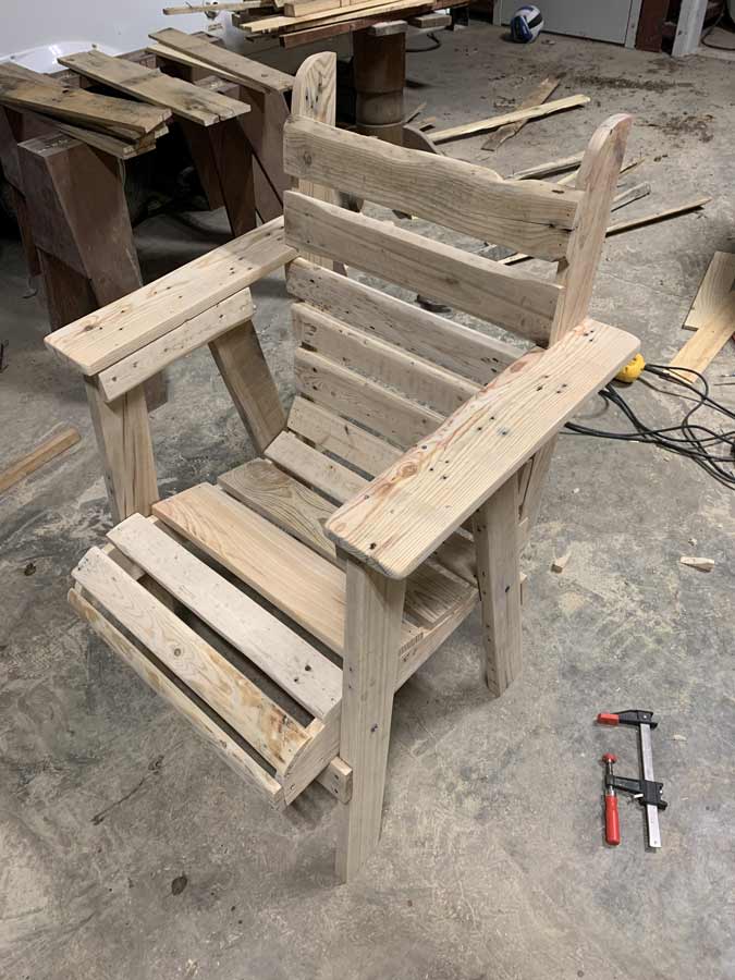 close up wood grain custom chair with high armrests by memphis area craftsman jordan trask with pallet materials creative stuff in mississippi
