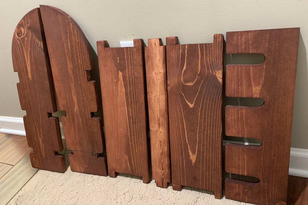panels for hand made wine rack that slides together with space for bottles and glasses to hang on wall of kitchen in olive branch ms