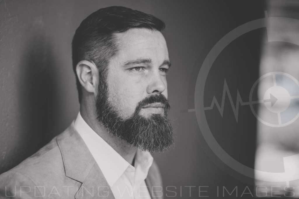 black and white headshot image of bearded man in suit facing to the right prefocus solutions logo down tunnel purposed to update website images for real estate entrepreneur near memphis tennessee to enhance conversion rates page views and improve seo rankings