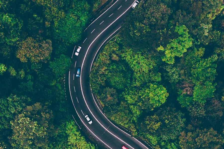 curving road heading away from memphis into central tennessee by drone videographer in olive branch for traveling website high quality overhead views