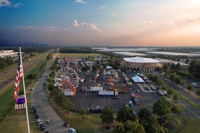 beautiful skyline photography southhaven mississippi for lander's center midsouth fair with american flag and sign by freeway for event services prefocus drone