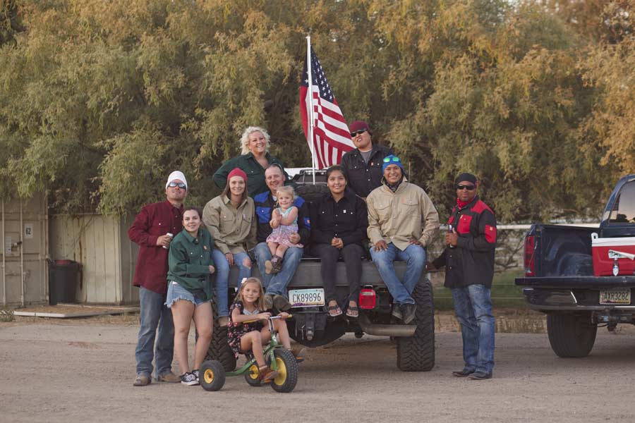 country cow farm American flag sitting on tailgate of pickup truck drinking beer team photo by branding professional prefocus solutions on site photographer and drone pilot near memphis tennessee