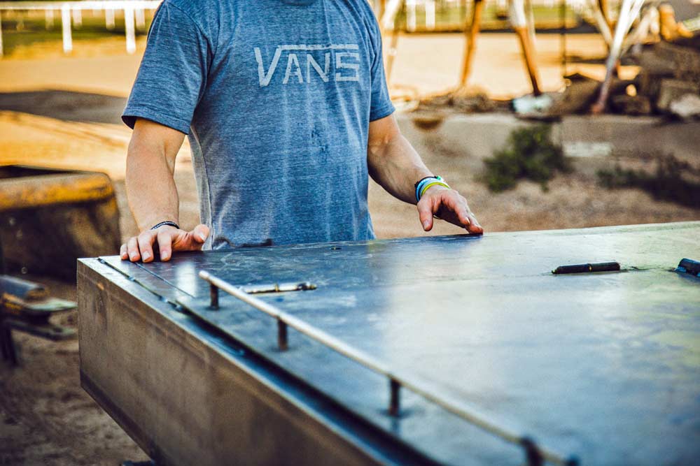 hands of creator and strategist JT bed of custom welding truck on location for western photo shoot near memphis tennessee