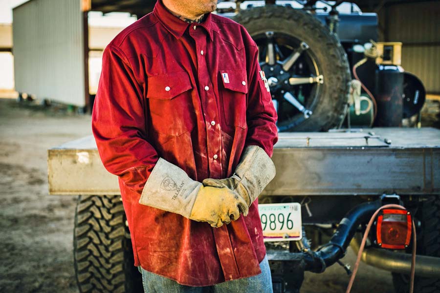 authentic image of welding professional removing fireproof gloves with quality work shirt dirtied for branded apparel strategy with creative director jordan trask of prefocus solutions on site photographer