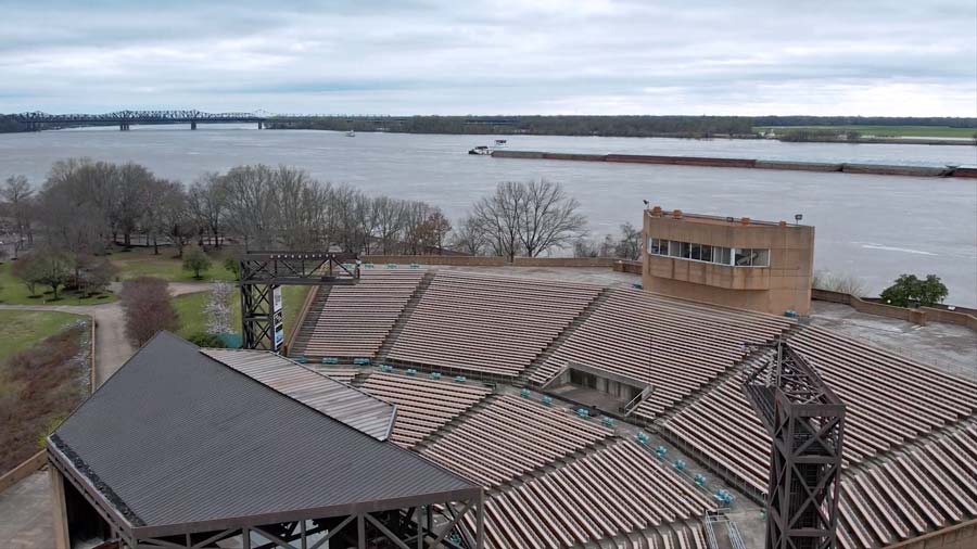 broad photograph of classic amphitheater in downtown memphis near riverpark walks by drone photographer jordan trask of prefocus solutions mississippi river in background with stage and lighting closed down