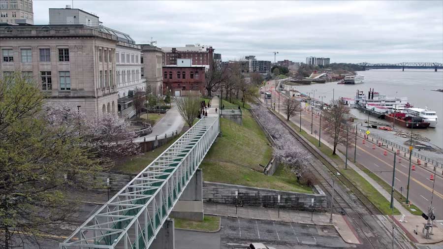 beautiful angle of pedestrian bridge near memphis suffrage monument and riverboat queen line tours with tn-arkansas bridge and railway in the background cityscape photographers midsouth prefocus 