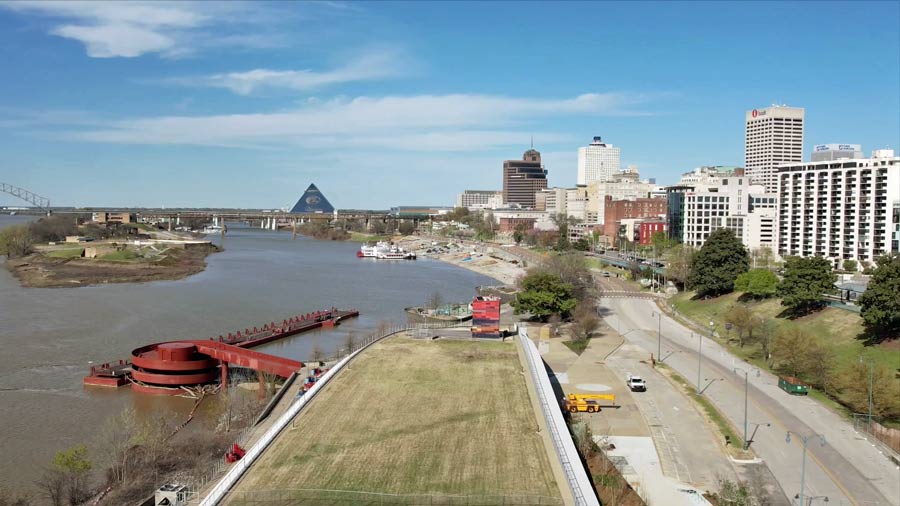 close up of large green lawn in front of beale street landing cultural center for memphis community gardens and river park upgrades captured by drone city skyline photographer prefocus solutions in desoto county ms bass pro pyramid in background