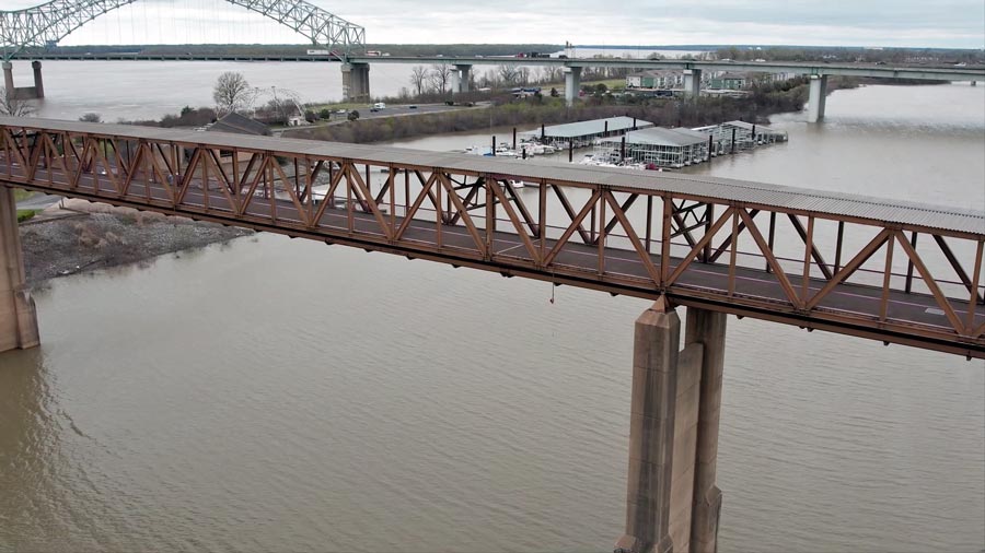 peering through modern park walkway over harbor looking down on memphis marina near riverparks new development for bluff city residents to explore caught on camera by drone pilot videographer jordan trask of prefocus solutions in desoto county ms